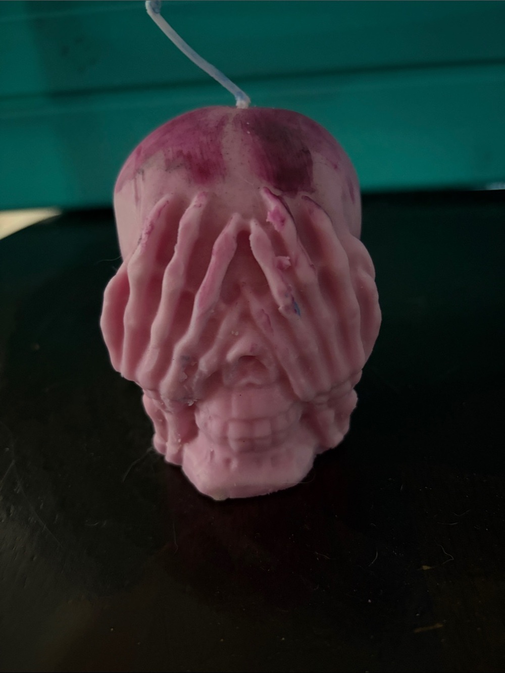 Pink Skull Candle with Hands Covering Face